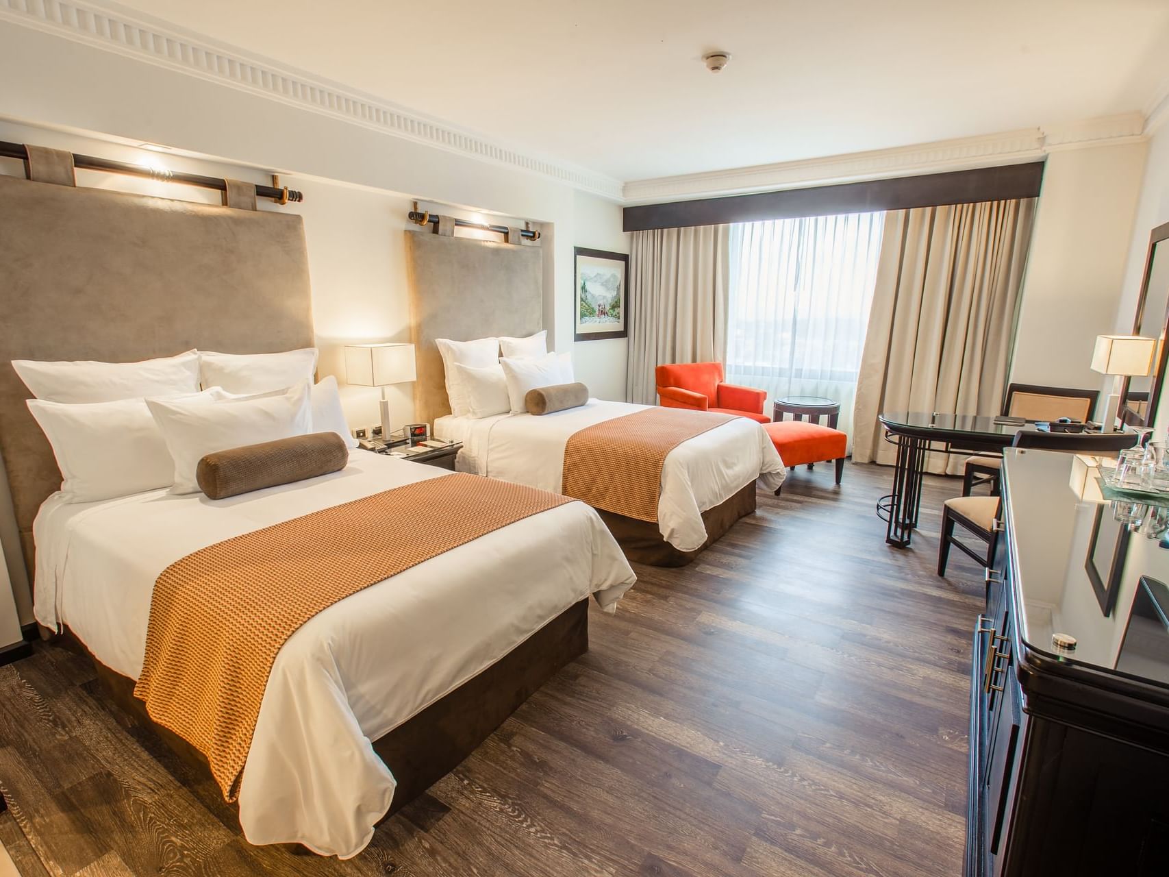 Twin beds & work desk in Deluxe Suite at Tikal Futura Hotel