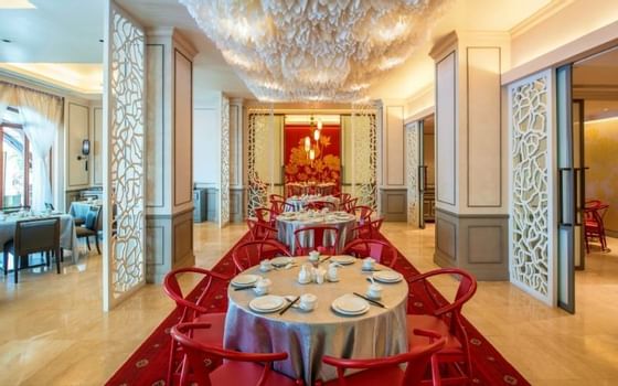 Dining tables in Tiger Hill at Chatrium Hotel Royal Lake Yangon