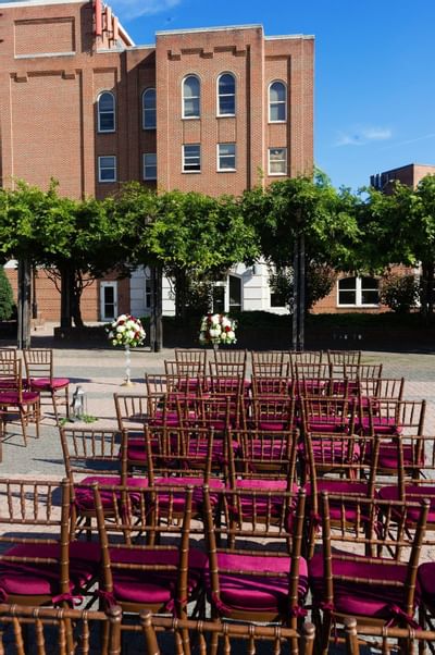 outdoor wedding venue with pink seats