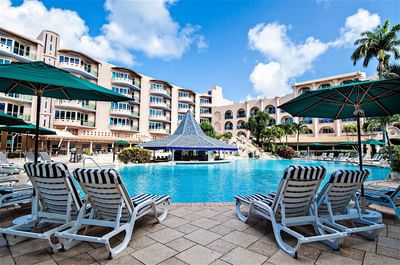 Sunbeds by the outdoor pool area at Accra Beach Hotel & Spa