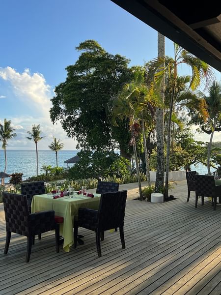 Outdoor dining area with ocean view at Wild Ginger Restaurant & Bar at Warwick Le Lagon - Vanuatu, Efate.