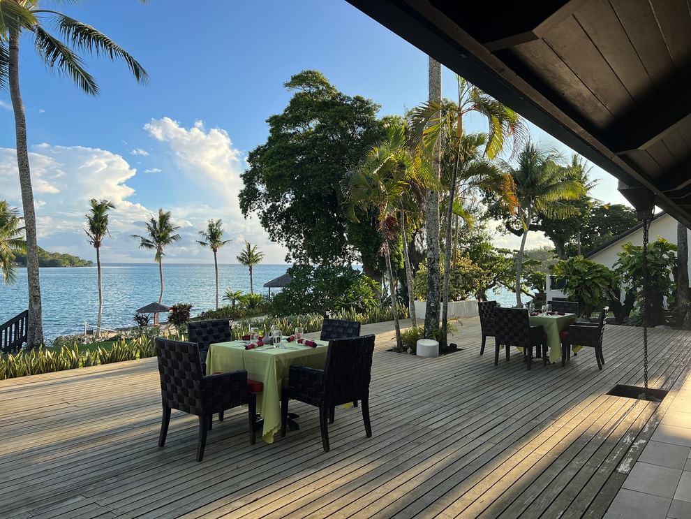 Outdoor dining area with ocean view at Wild Ginger Restaurant & Bar at Warwick Le Lagon - Vanuatu, Efate.