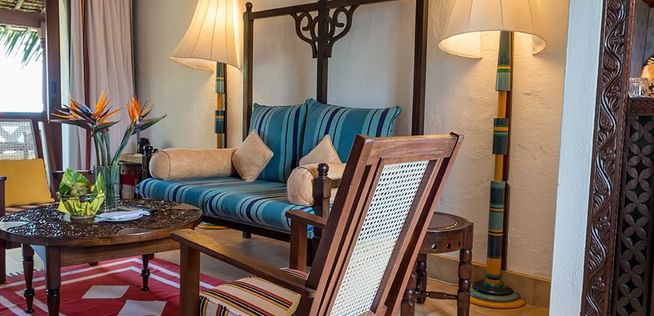 Lamu Suite with couch and chairs at Serena Beach Resort & Spa