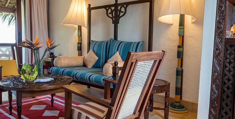 Lamu Suite with couch and chairs at Serena Beach Resort & Spa