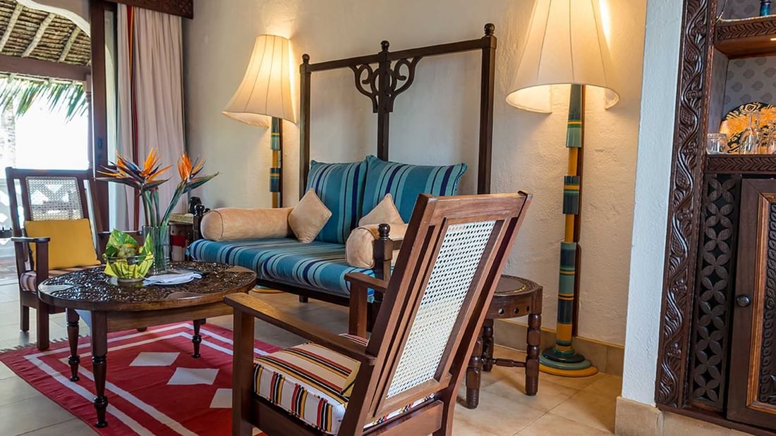 Lamu Suite with couch and chairs at Serena Beach Resort & Spa