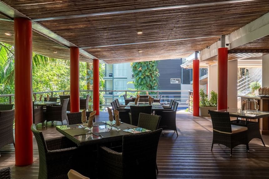 Dining tables arranged in Sloth Snack Bar at Jungle Vista Boutique Hotel