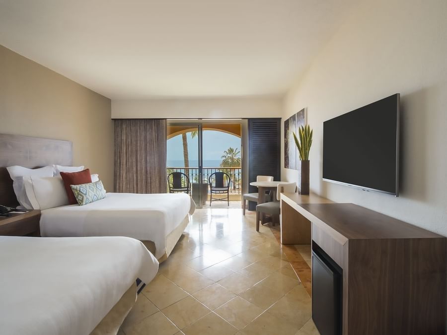 2 Double beds, Chairs & TV in Deluxe room at GFA Los Cabos