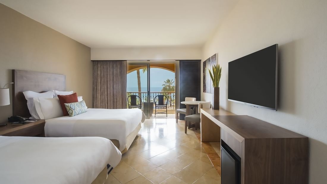 2 Double beds, Chairs & TV in Deluxe room at GFA Los Cabos