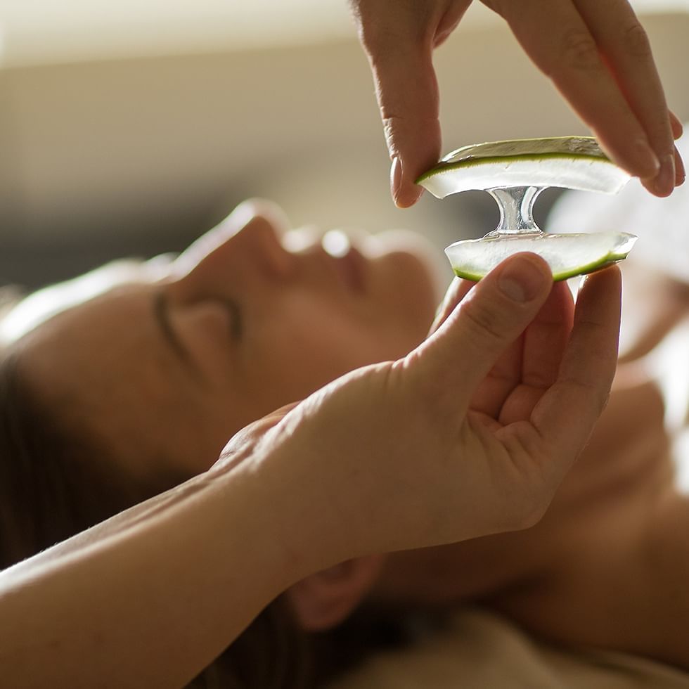 Applying aloe vera remedy for a woman at Falkensteiner Hotels