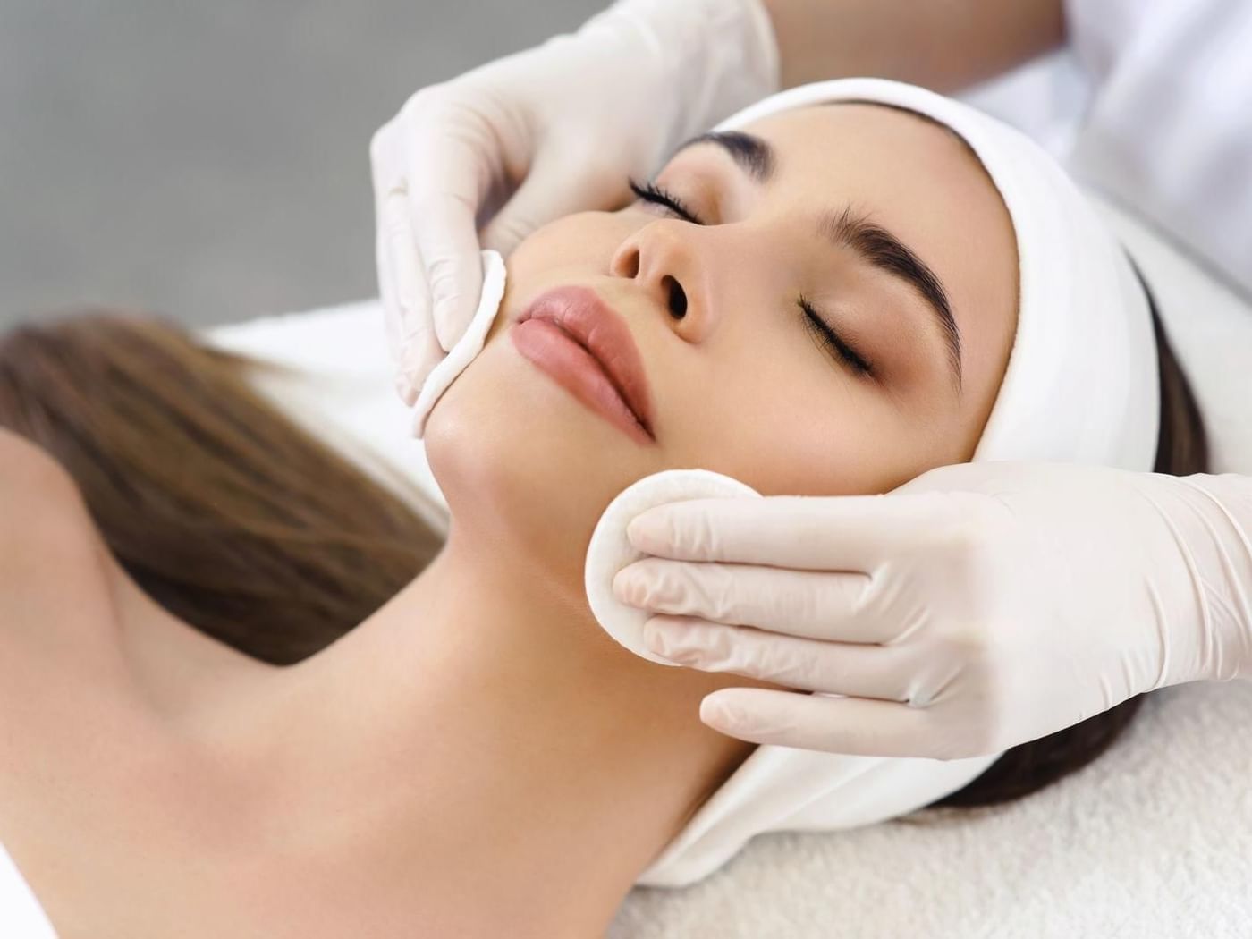 Lady getting a facials from the spa at Grand Fiesta Americana