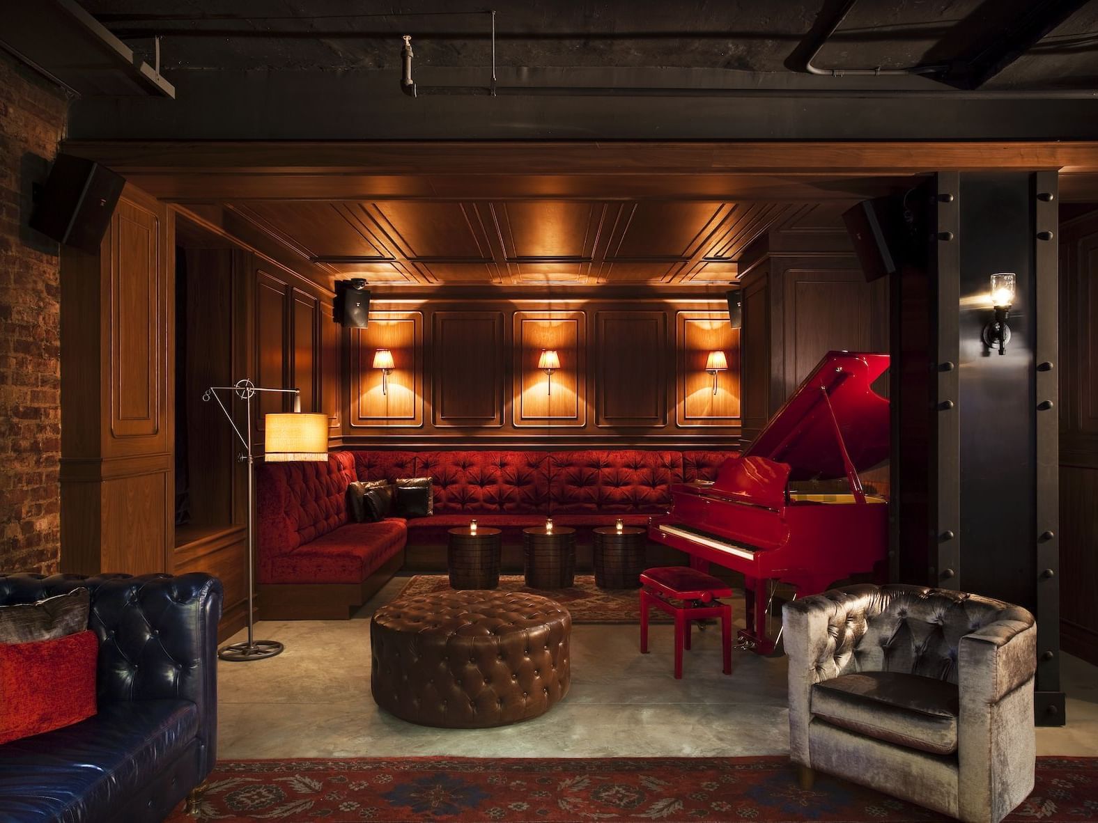 a couch and piano in a lounge