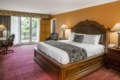 Pool view suite with king bed.
