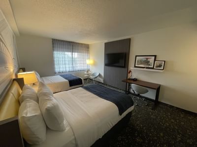 Two beds, TV & workspace in Double Queen Standard at St. Louis Airport Hotel