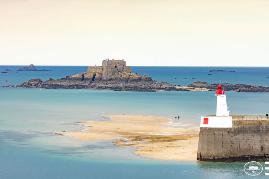 Distant view of Petit Be Fort by the sea near Le Grand Hôtel des Thermes