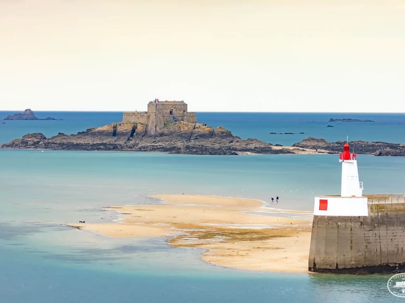 Distant view of Petit Be Fort by the sea near Le Grand Hôtel des Thermes