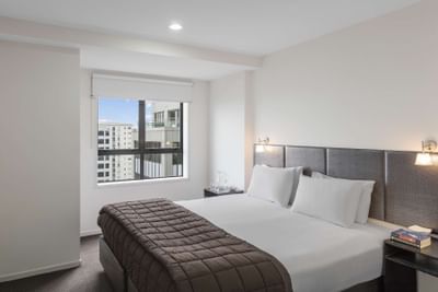 Comfy bed in One Bedroom Apartment at Nesuto St Martins Hotel