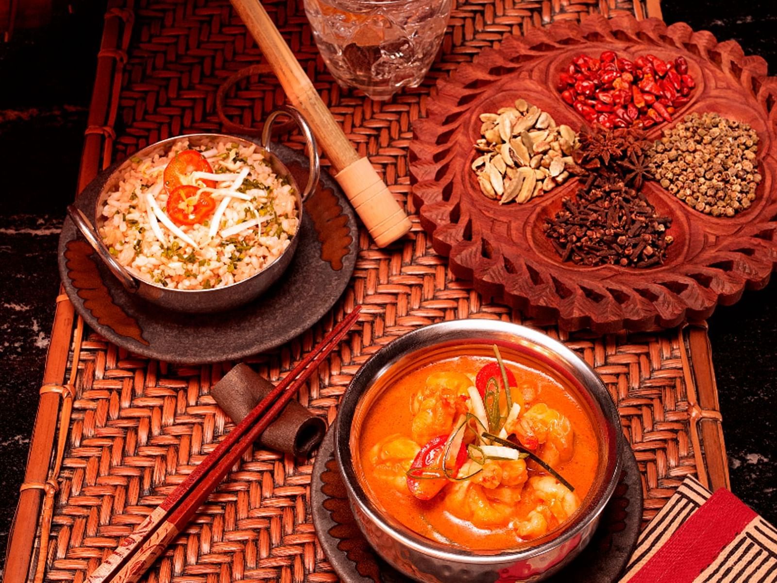 Asian cuisine with a bowl of rice and a spicy shrimp dish served at Live Aqua Resort & Residence