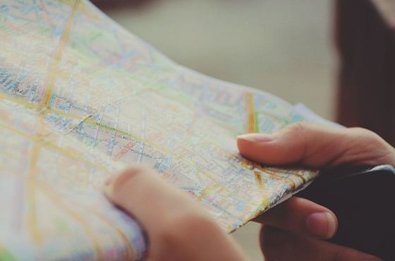 Closeup of a girl holding a map at Oliver Like Home