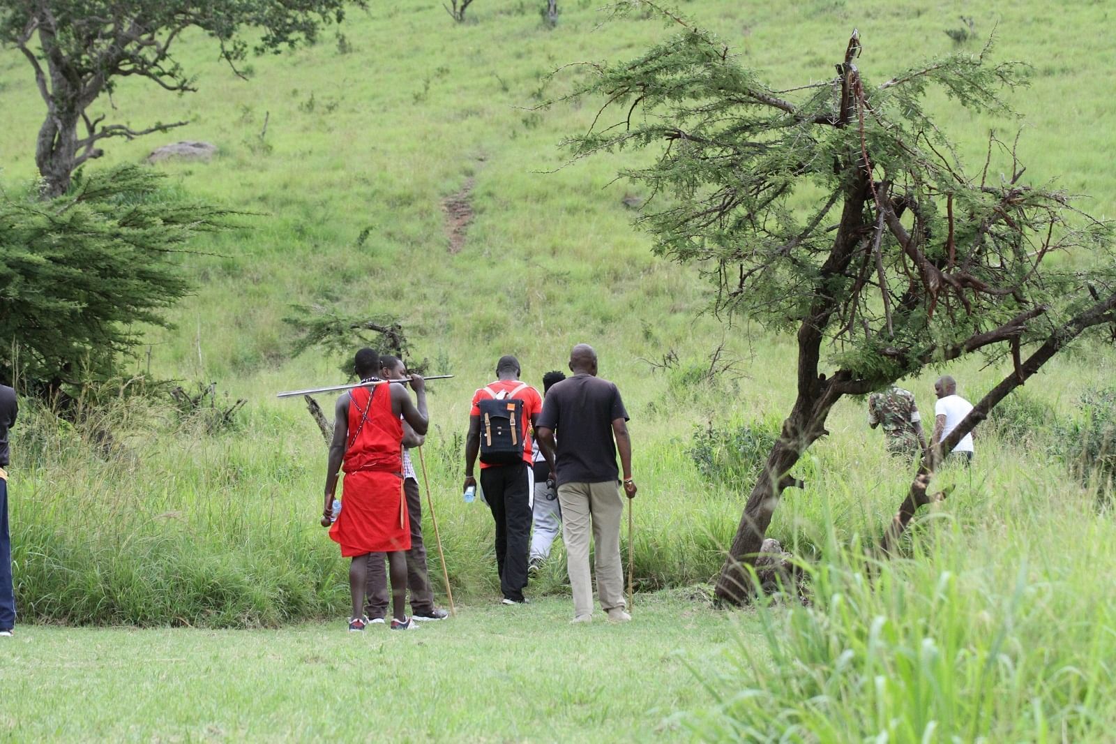 View of people hiking on a hill at Mara Serena Safari Lodge