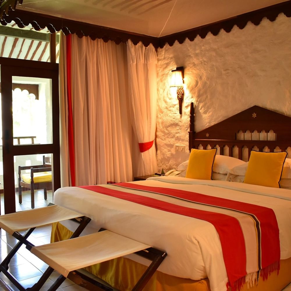 Deluxe Queen Garden View room with balcony at Serena Beach Resort & Spa in Mombasa.