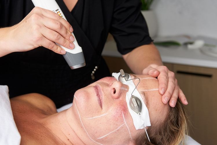 Close-up of a lady getting Laser Genesis at Nita Lake Lodge