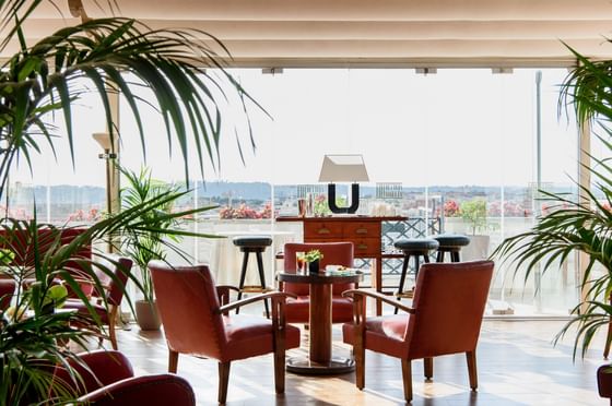 Lounge area with Red chairs & Coffee table in Ligea Lounge Bar at Bettoja Hotel Atlantico