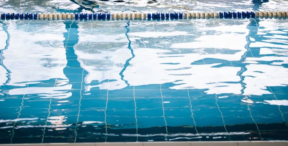 A woman swimming in the pool at Hotel Chester St Davids