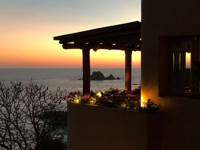 Balcony with flowers & lights during sunset at Cala de Mar
