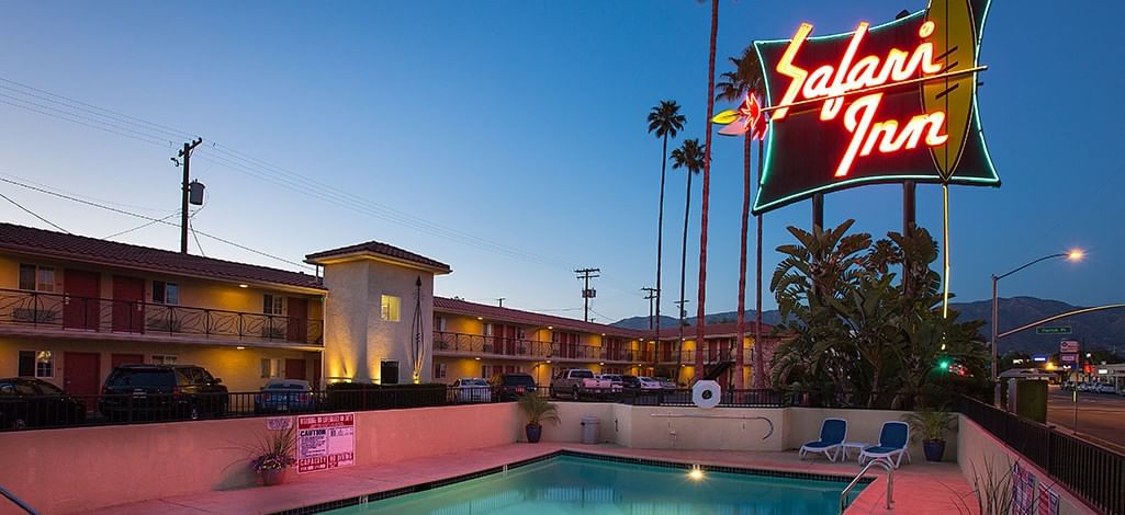 Safari Inn pool beneath the hotels iconic neon sign in Burbank
