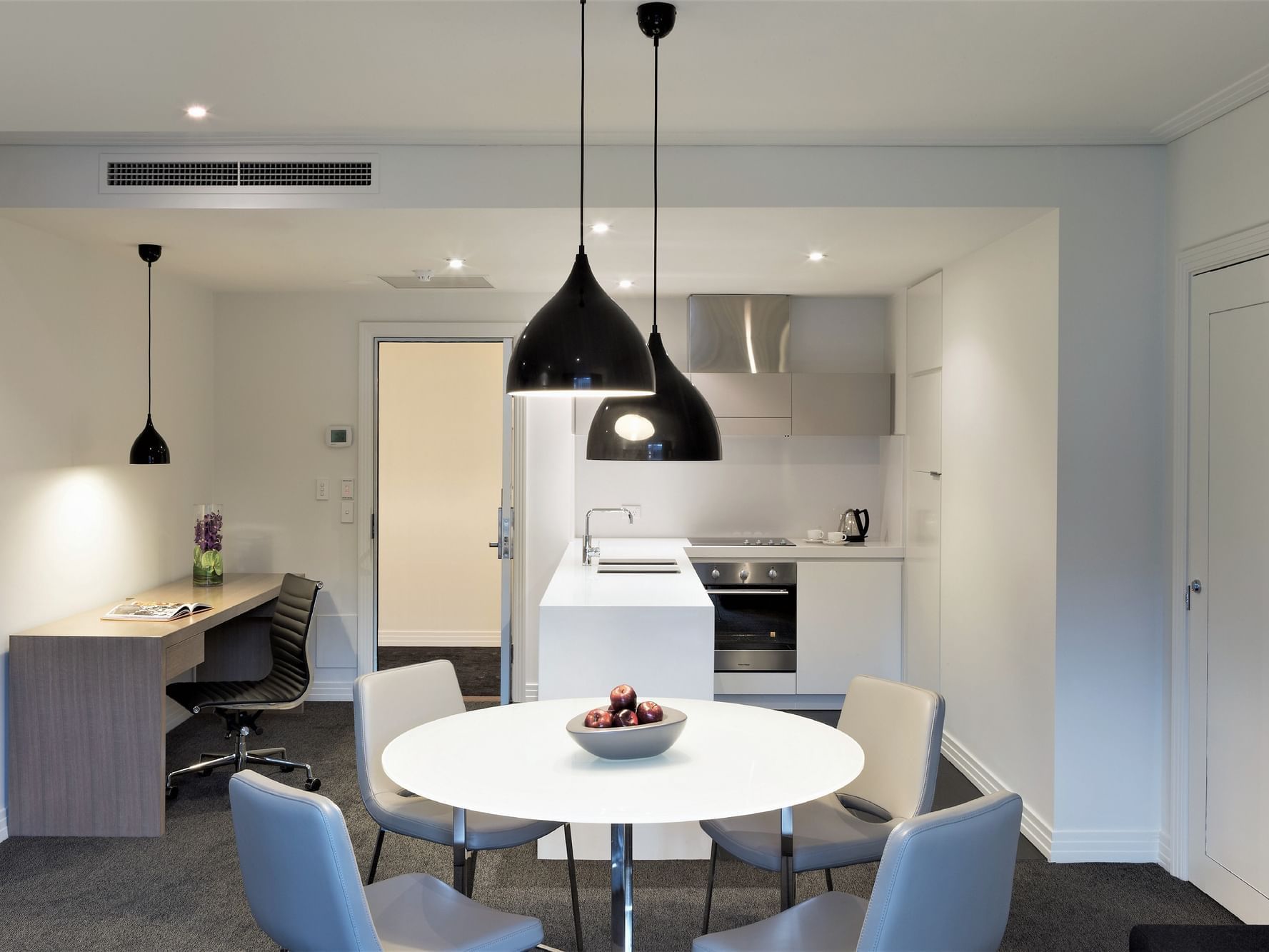 1 Bedroom Apartment kitchen & dining area at Como Melbourne
