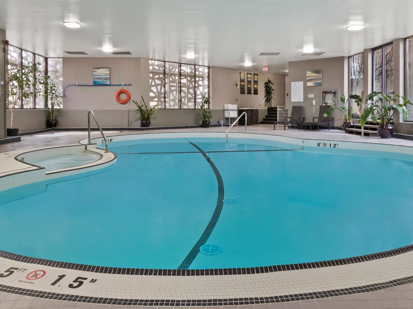 A spacious indoor swimming pool at Best Western Premier