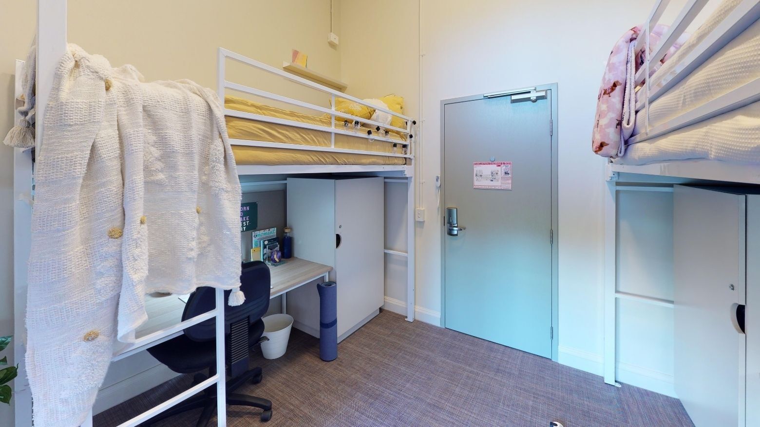 Twin Loft room with two loft bunk beds and desks underneath at UniLodge Herston.
