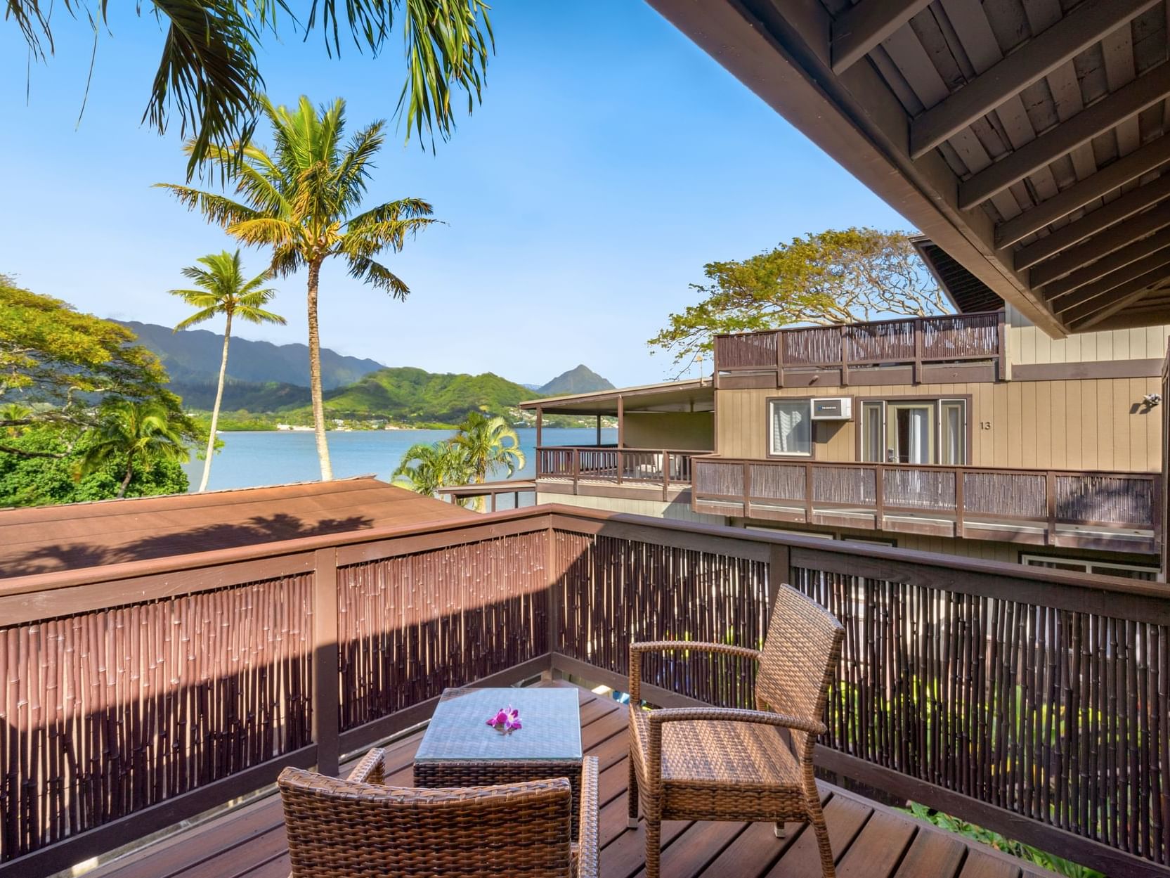 Balcony lounge area in Two-Bedroom Suite Bay View at Paradise Bay Resort