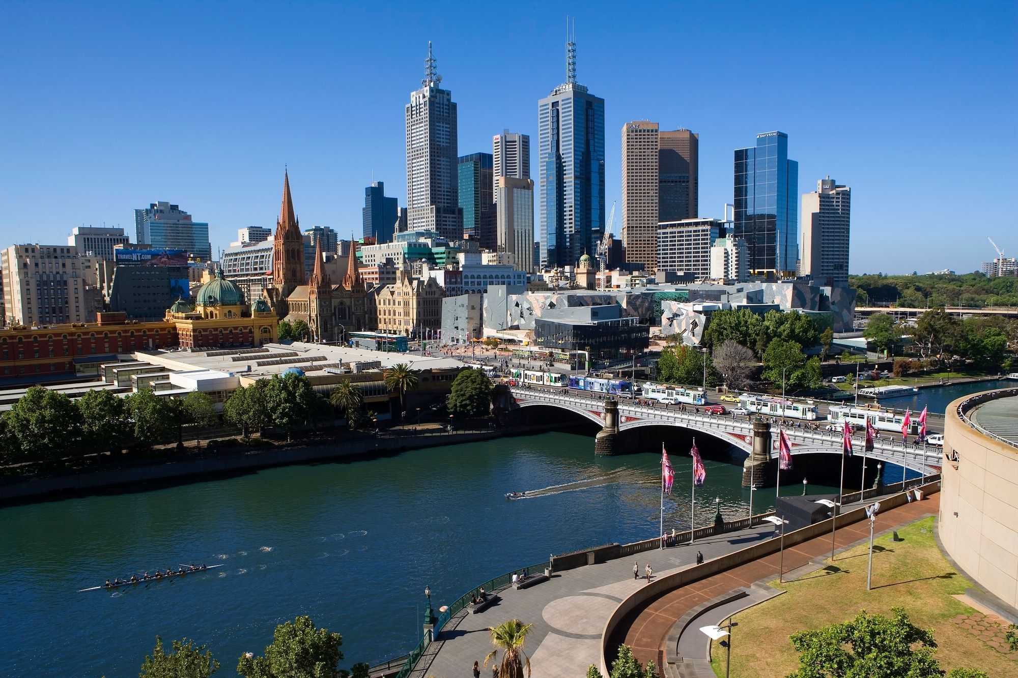 Distant view of the city & Princes Bridge on a sunny day near Quay West Suites Melbourne