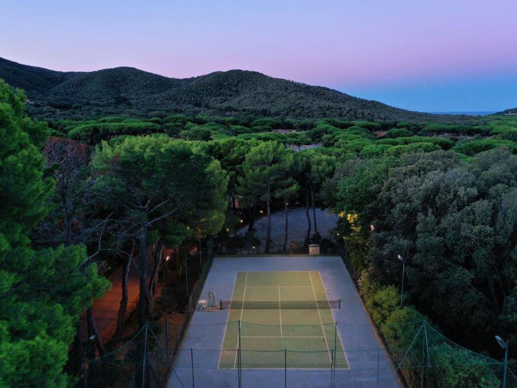 Aerial view of an outdoor Tennis Court at Golf Hotel Punta Ala