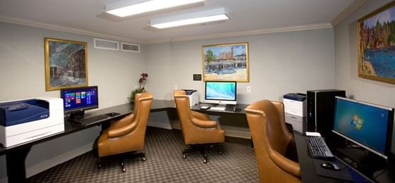 Computer room with machines & comfy chairs at Townsend Hotel