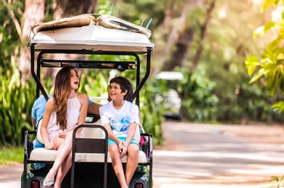 Kids Riding in Golf Cart on Nature Trail