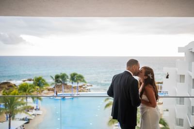Couple kissing by the balcony, The Morgan Resort Spa Village