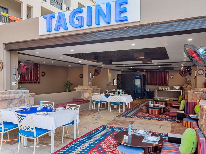 Tagine A La Carte restaurant entrance with blue sign at Pickalbatros Palace Hotel in Red Sea Governorate.