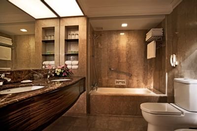 Bathroom with vanity & bathtub in Premier Room at York Hotel Singapore