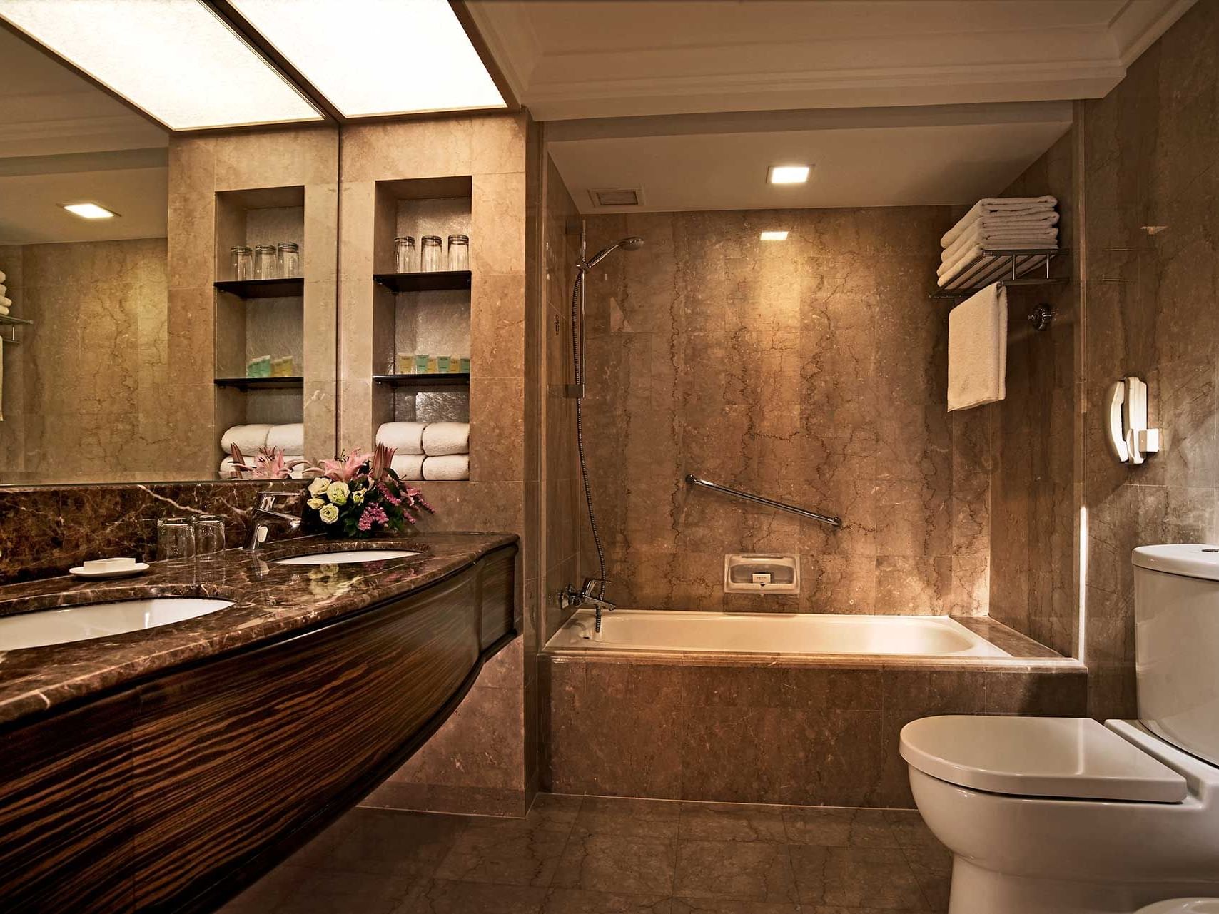 Bathroom with vanity & bathtub in Premier Room at York Hotel Singapore