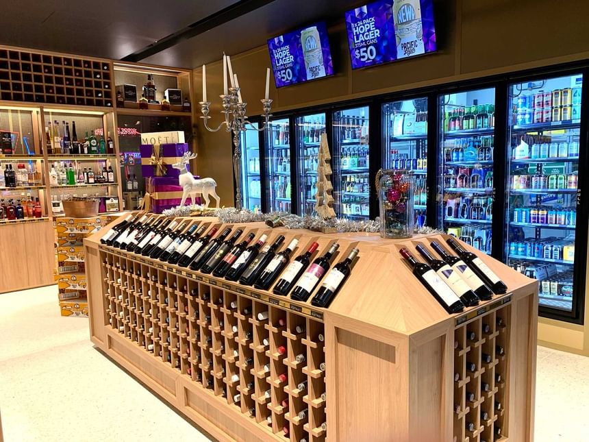 An interior view of a wine store with a wide range of wine brands at Encore by Mingara