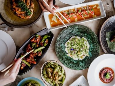 Well-arranged table featuring vibrant dishes displayed on elegant pottery at The Kitchens