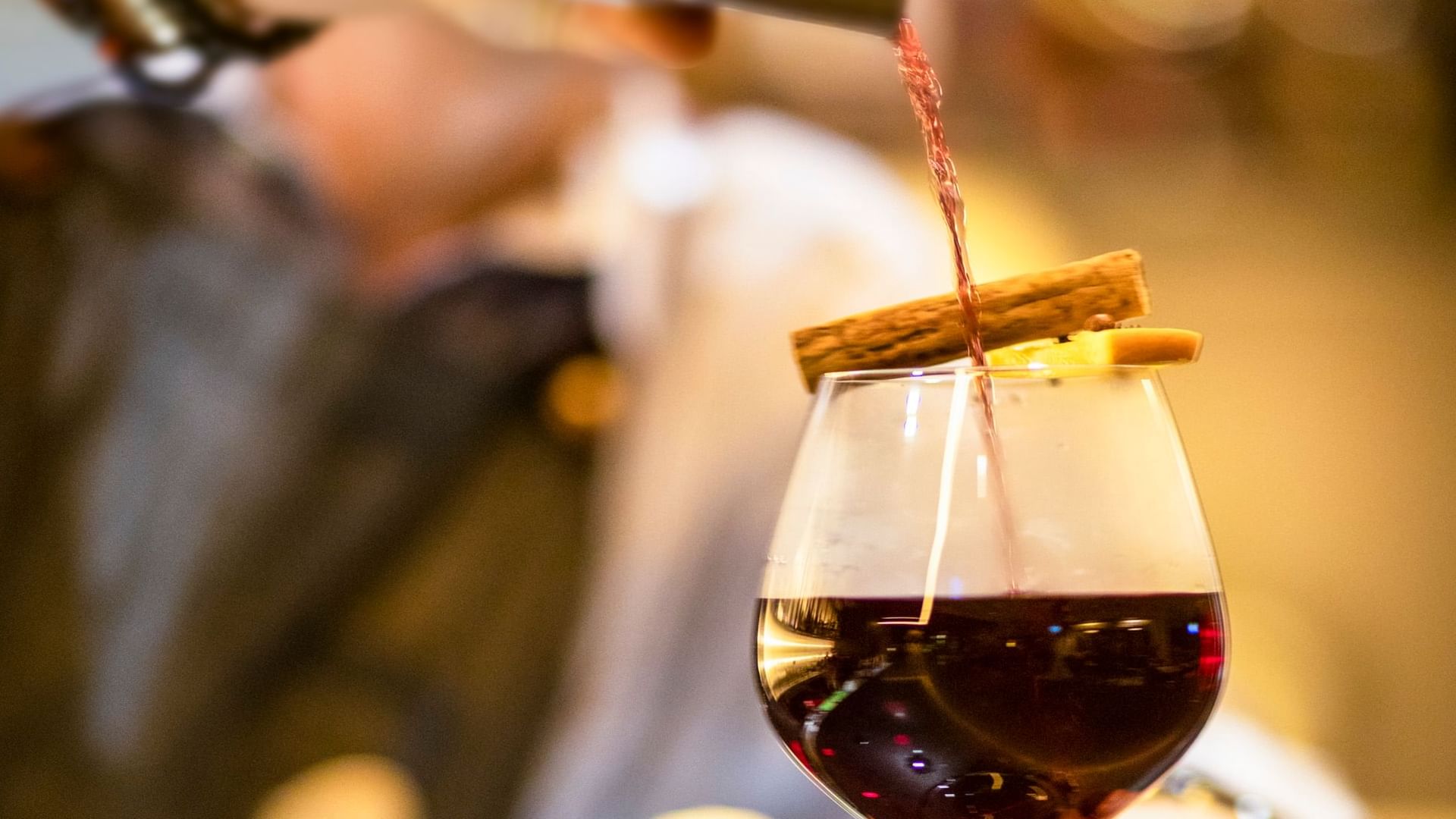 Close up of bartender pouring wine at Novotel Melbourne