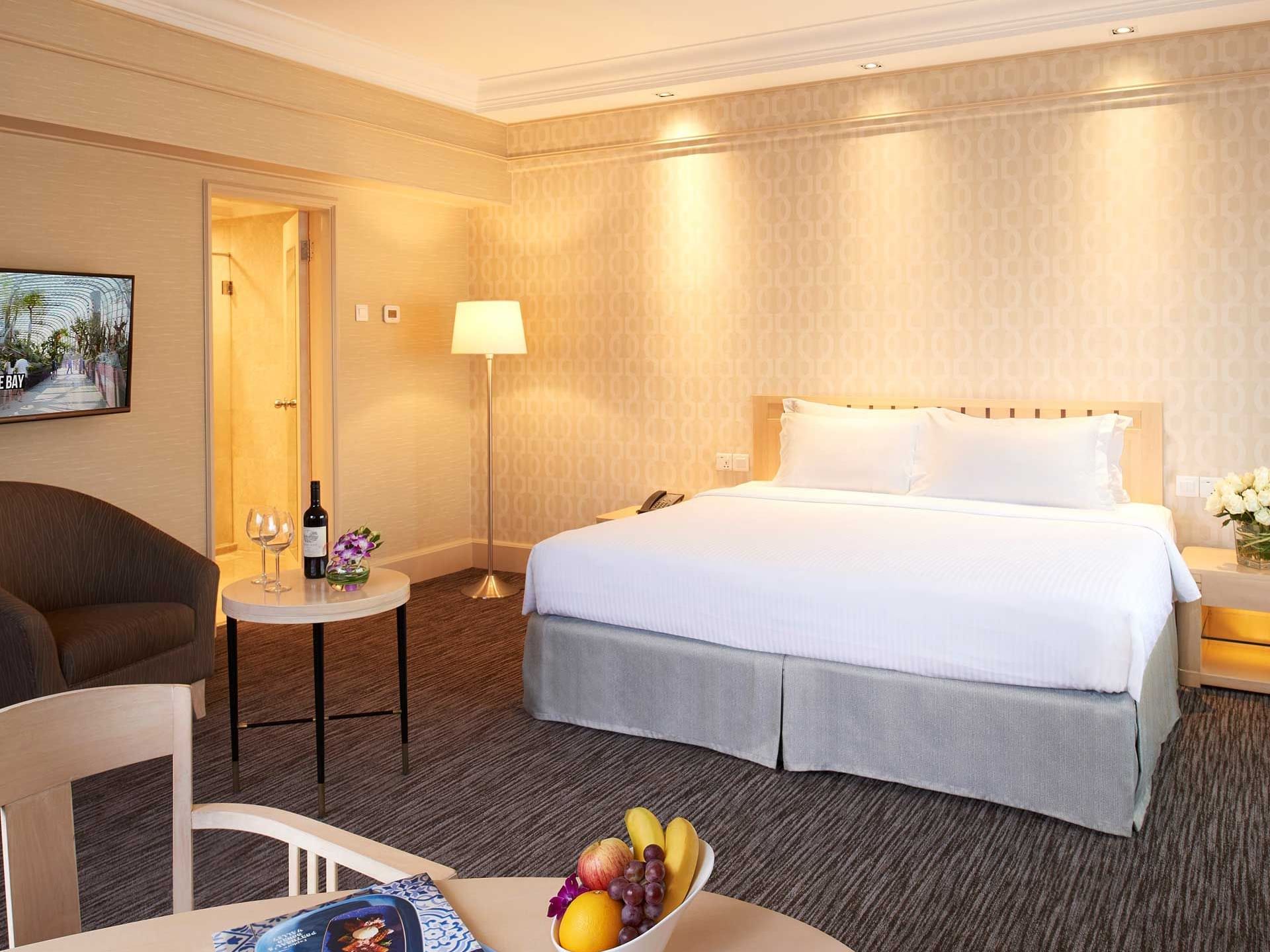 King bed in Deluxe Room with carpeted floors at York Hotel Singapore