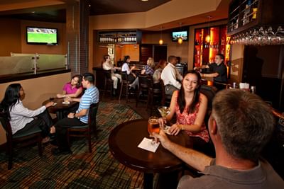 People in Zebra's Sports Bar & Grille at Rosen Inn at Pointe Orlando