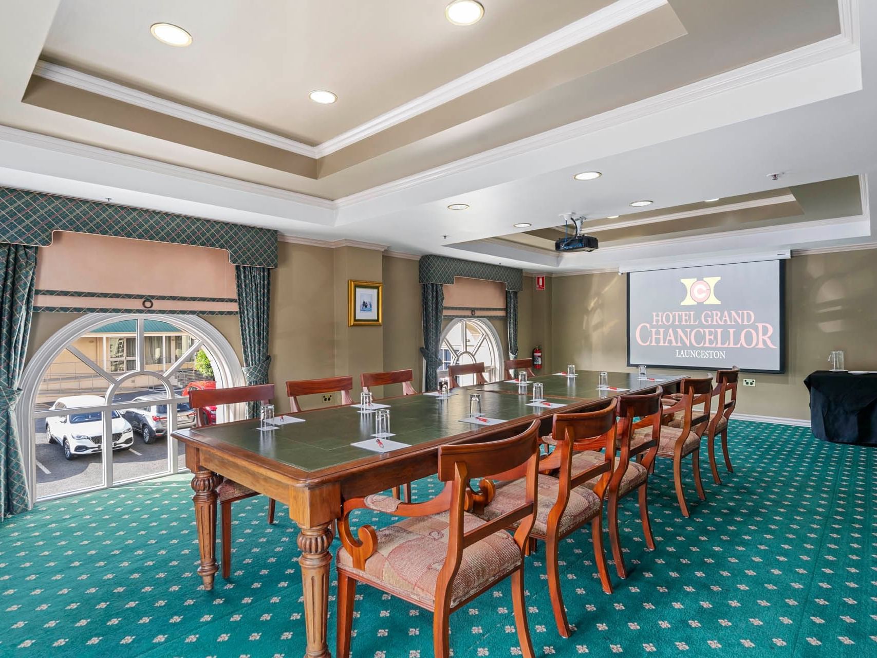 Boardroom set-up on matted floor with projector in Chancellor 8 at Hotel Grand Chancellor Launceston