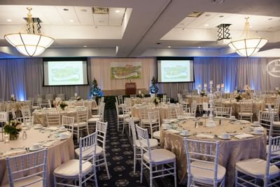 Banquet tables arranged for an event at UMass Lowell Inn