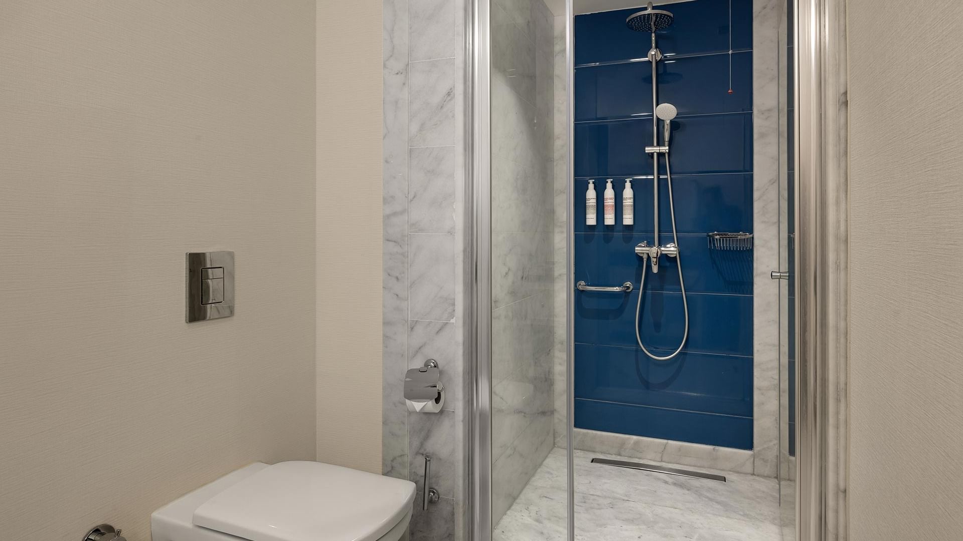 Standard Room bathroom with shower and toilet at Titanic Deluxe Golf Belek in Antalya.