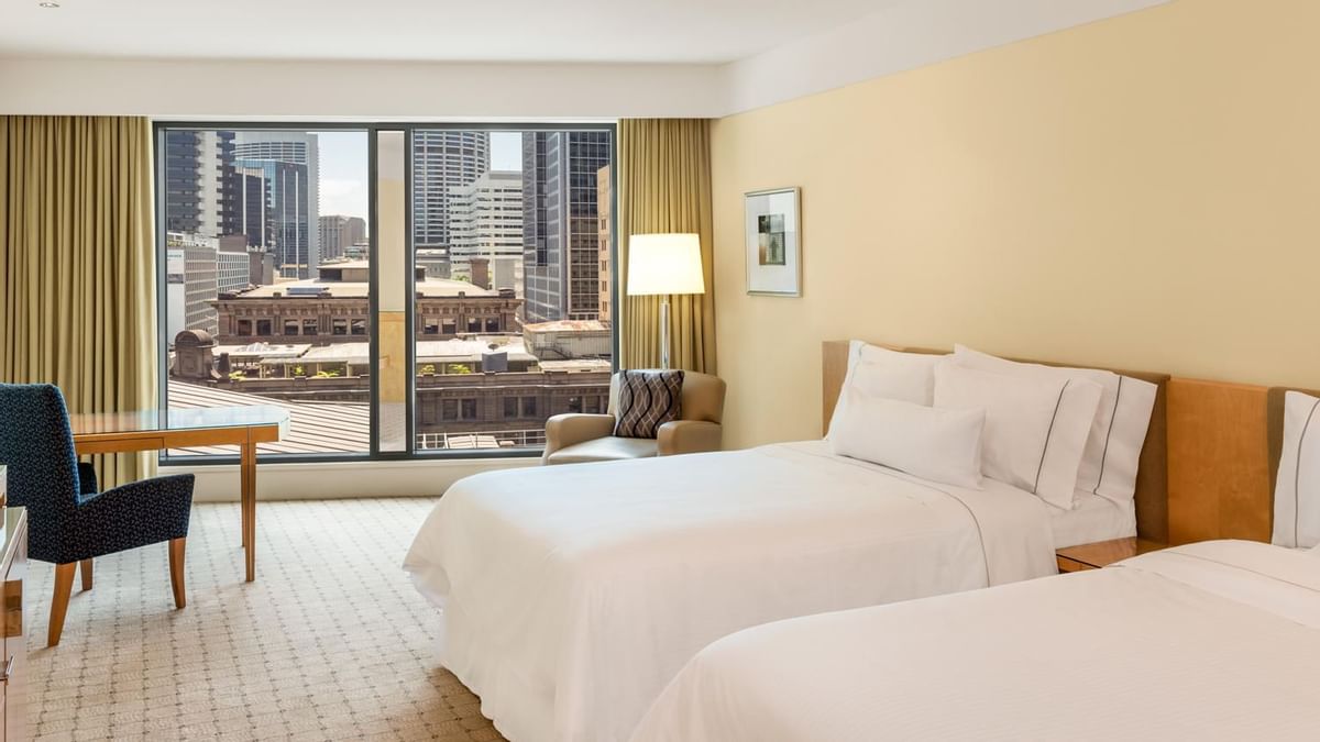 Interior of a room with a twin bed at Fullerton Sydney